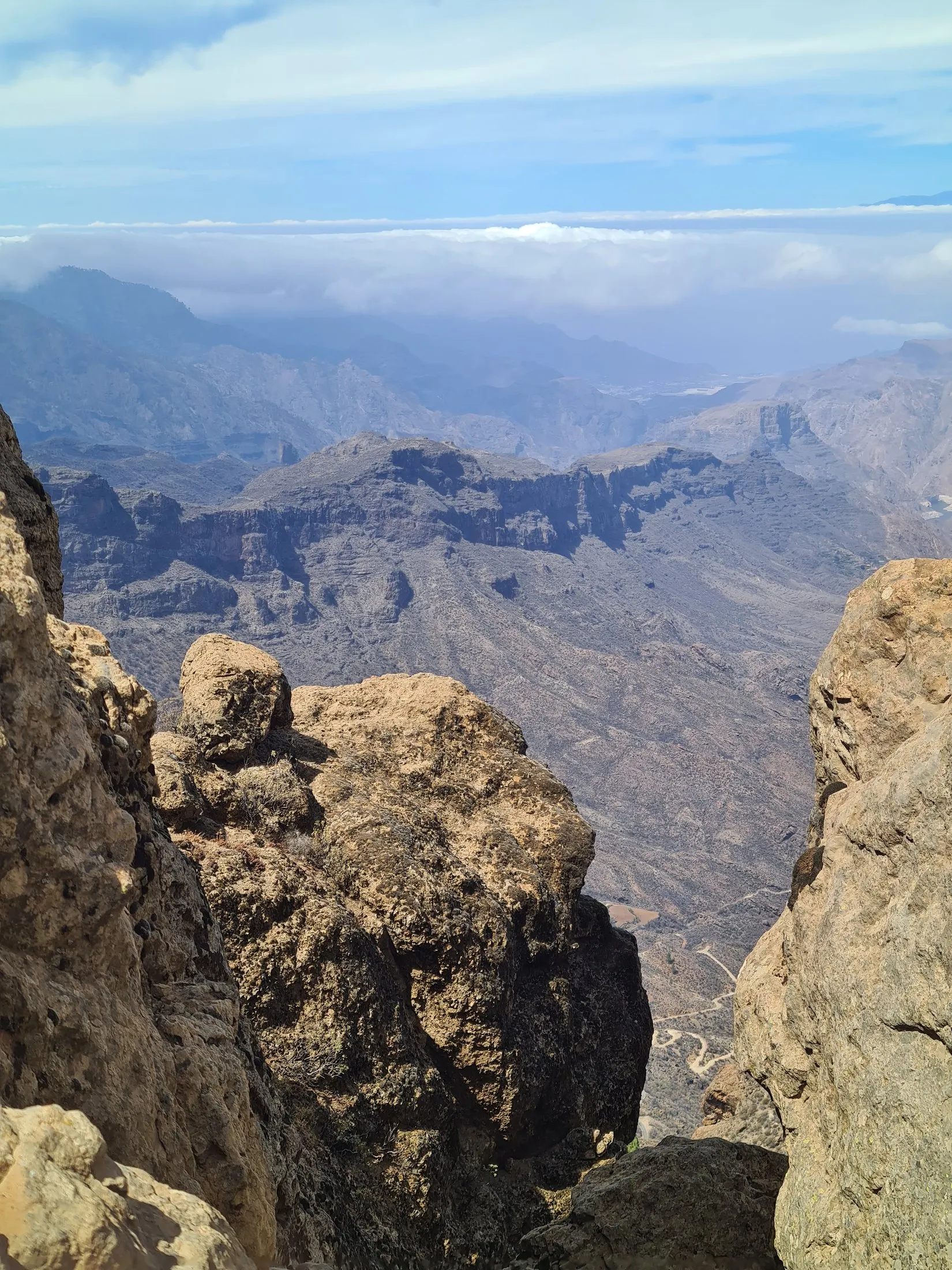 A rocky outcrop above a deep volcanic valley