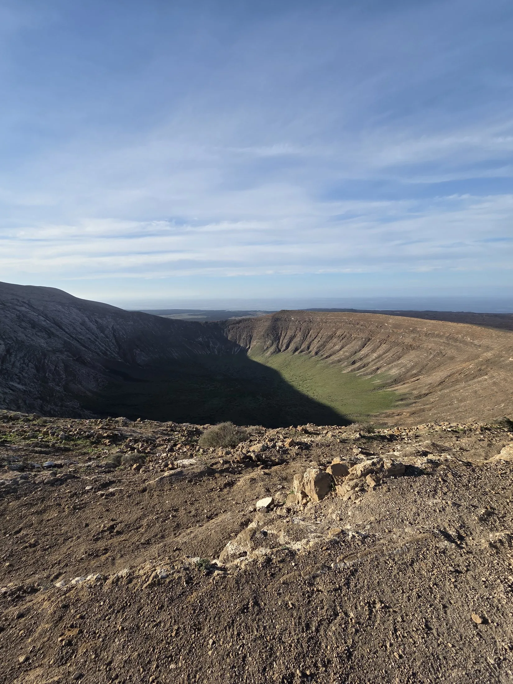 A path across a wide volcanic plain