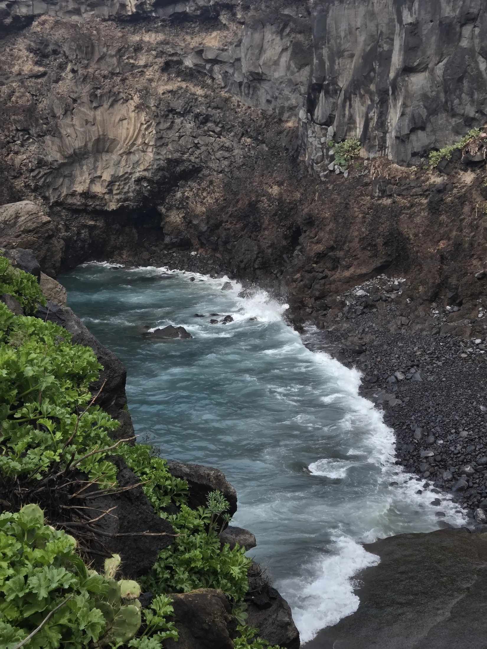 Sea pouring through a narrow cut in the rock